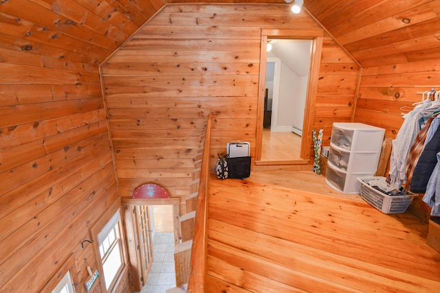 bonus room featuring wood ceiling, vaulted ceiling, wood walls, and baseboard heating