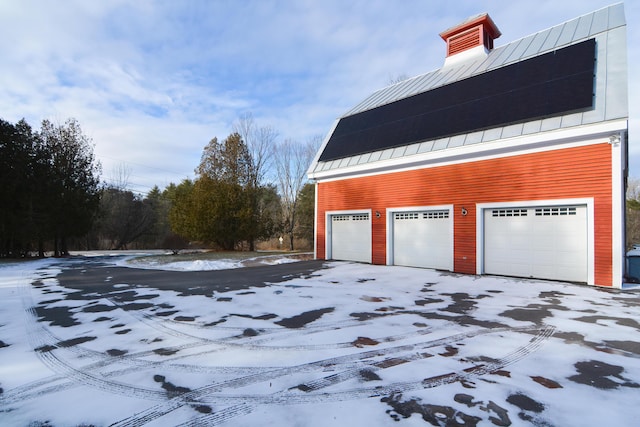 view of snow covered garage