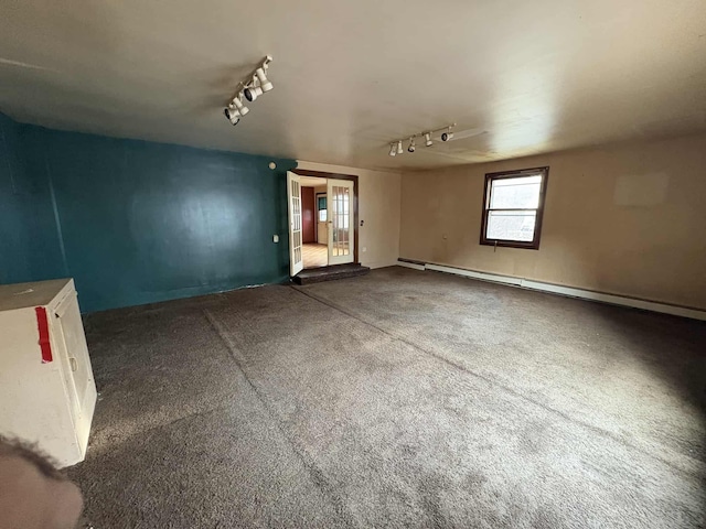 interior space featuring baseboard heating and track lighting