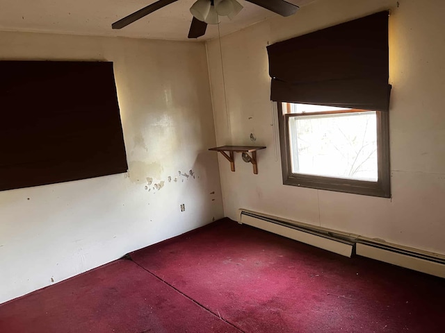 empty room with baseboard heating and ceiling fan