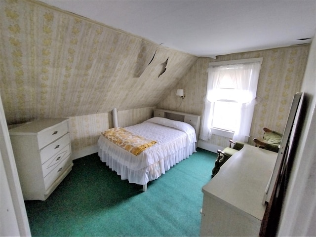 bedroom with carpet and lofted ceiling