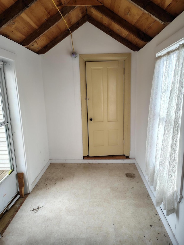 interior space with vaulted ceiling with beams and wooden ceiling