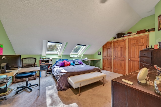 carpeted bedroom with lofted ceiling and a textured ceiling