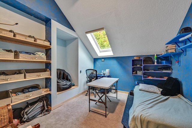 carpeted bedroom with a textured ceiling and vaulted ceiling