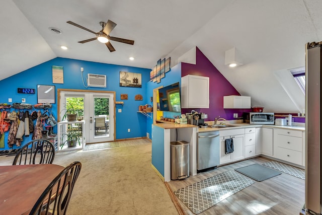 kitchen with wood counters, sink, ceiling fan, appliances with stainless steel finishes, and white cabinetry