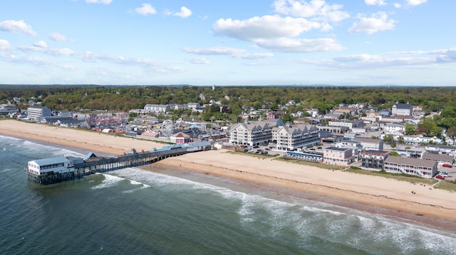 birds eye view of property with a water view and a view of the beach