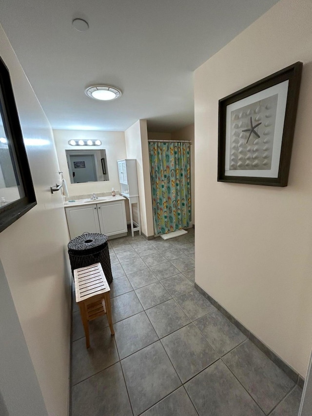 bathroom with tile patterned flooring, vanity, and a shower with shower curtain