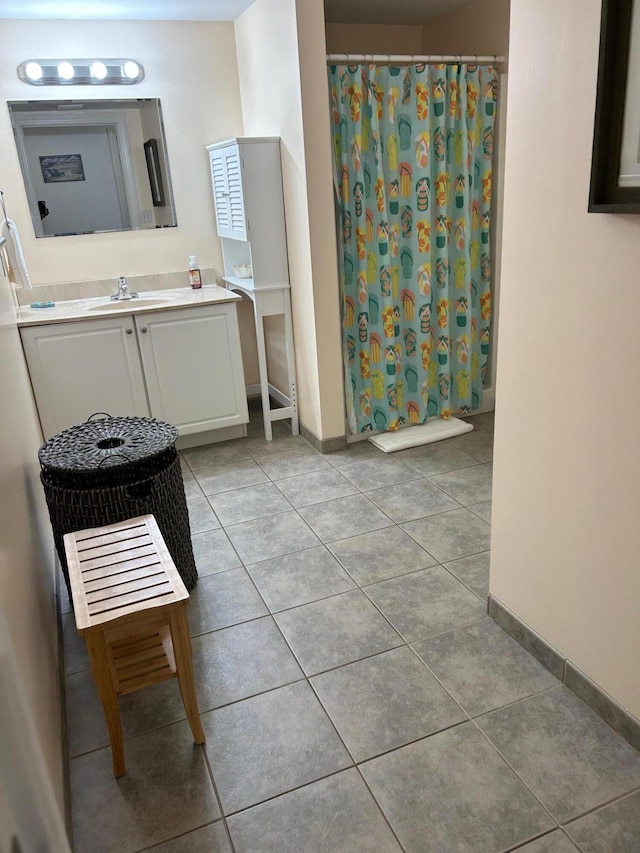 bathroom featuring a shower with curtain, tile patterned flooring, and vanity