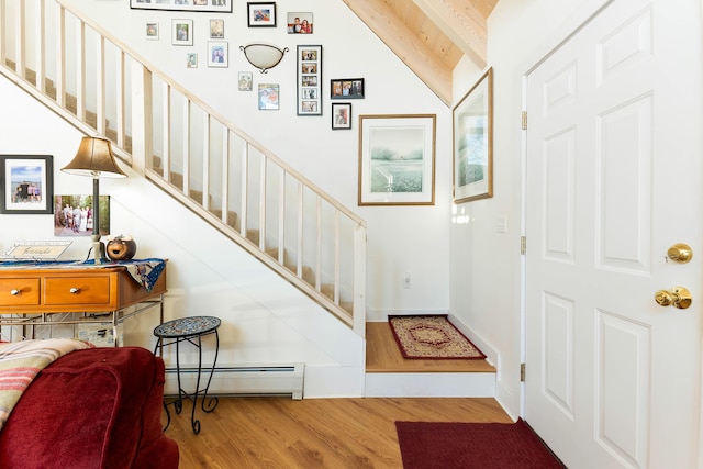 foyer entrance with hardwood / wood-style flooring, lofted ceiling with beams, wooden ceiling, and a baseboard radiator