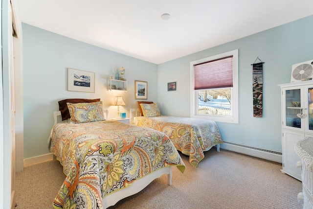 bedroom with light colored carpet and baseboard heating