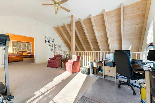 home office featuring carpet flooring, ceiling fan, vaulted ceiling with beams, and wooden ceiling