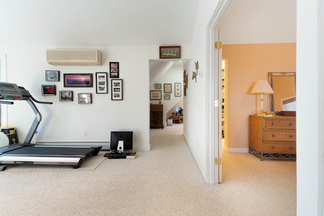 workout area with a wall mounted AC and carpet