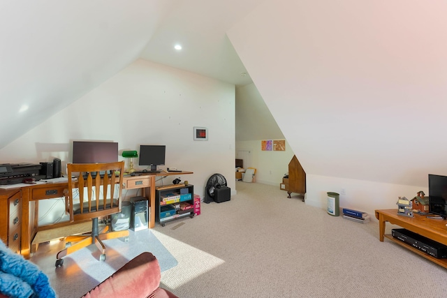 carpeted office featuring lofted ceiling