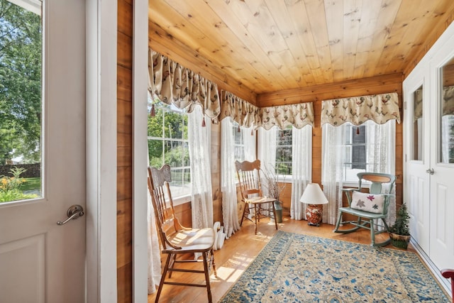 sunroom / solarium featuring wood ceiling