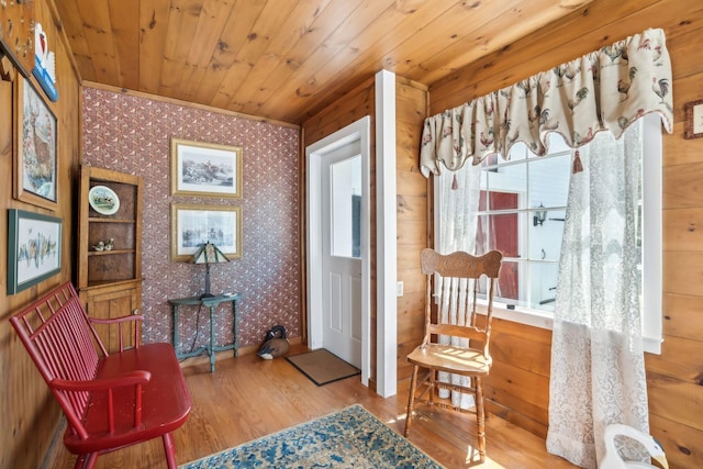 sitting room featuring hardwood / wood-style flooring and wooden ceiling