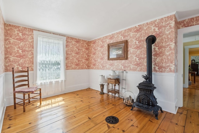 sitting room featuring light hardwood / wood-style flooring and ornamental molding