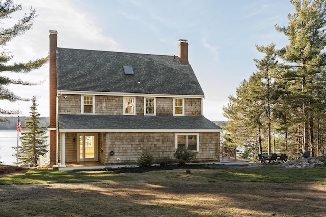 back of house featuring a yard