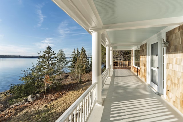 balcony featuring a water view