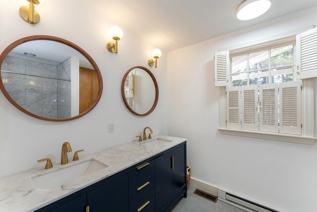 bathroom featuring vanity and a baseboard heating unit