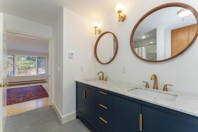 bathroom with vanity, tile patterned floors, and a baseboard heating unit