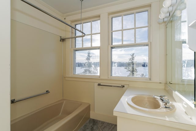 bathroom featuring shower / bathing tub combination, vanity, and ornamental molding