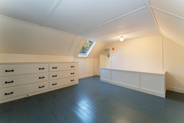 additional living space with lofted ceiling and dark wood-type flooring