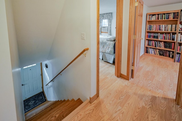 stairway featuring wood-type flooring