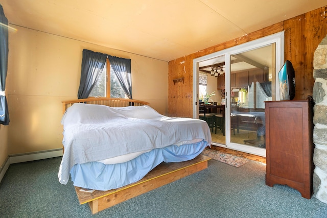 carpeted bedroom featuring wooden walls