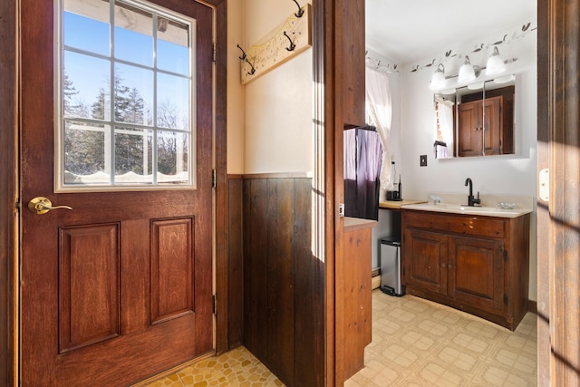 2700 Bristol Rd, Bristol, ME 04554 - bathroom featuring healthy amount of natural light, vanity, tile patterned floors, and wainscoting