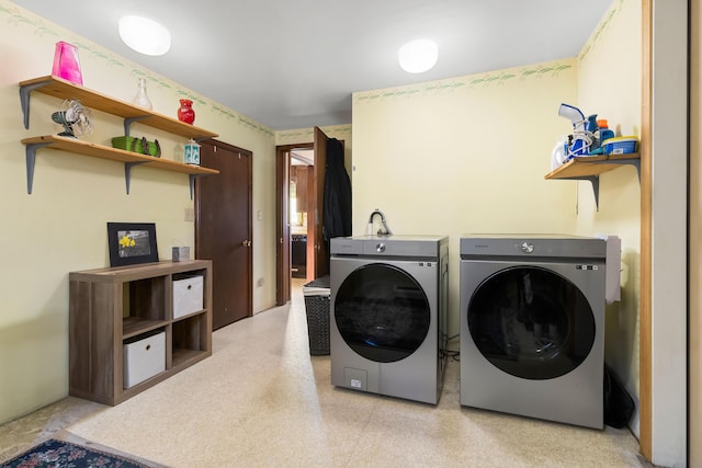 clothes washing area with washer and dryer