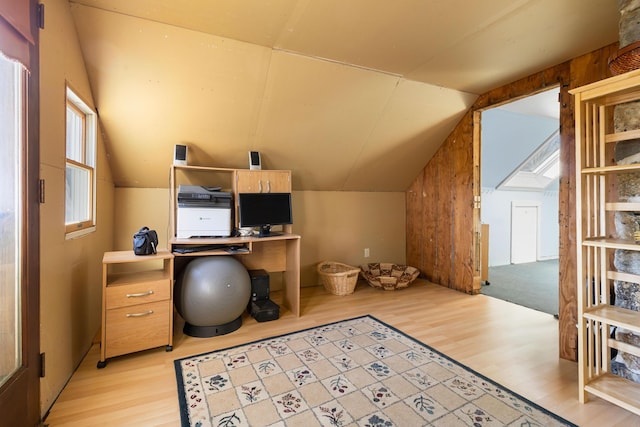 office featuring light hardwood / wood-style floors and vaulted ceiling