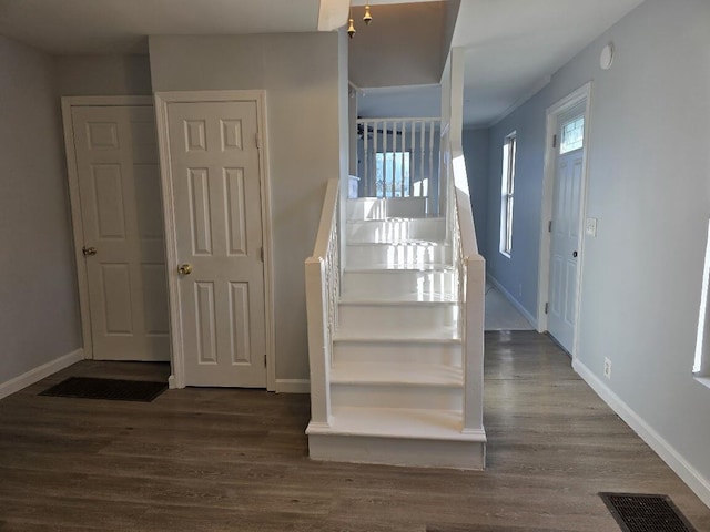 stairs with hardwood / wood-style flooring