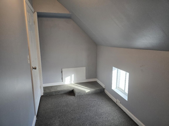 bonus room featuring carpet floors and lofted ceiling