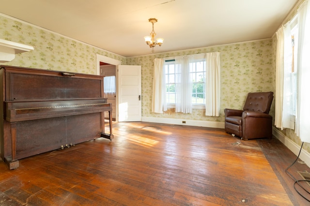 living area with a chandelier and dark wood-type flooring