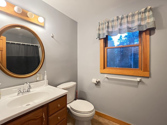 11 Crows Rd, Greenville, ME 04441 - full bath with vanity, toilet, and baseboards
