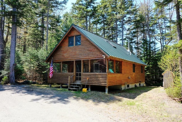 11 Crows Rd, Greenville, ME 04441 - log-style house with metal roof