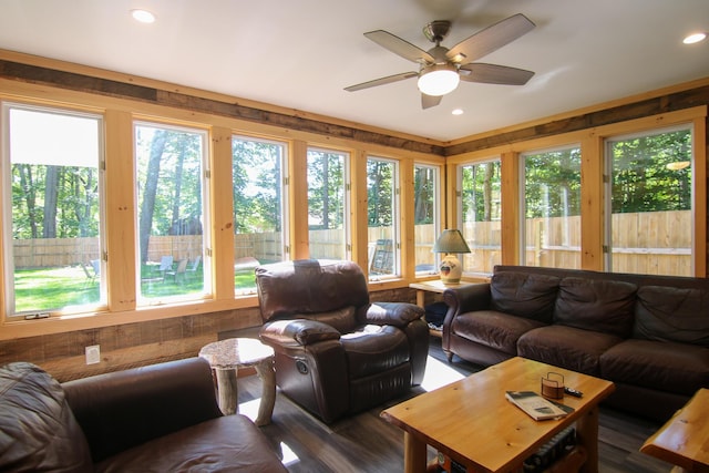 sunroom / solarium with a wealth of natural light and ceiling fan