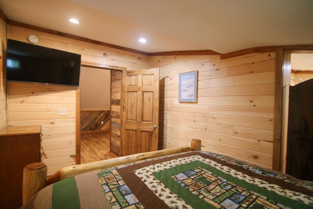 bedroom with wooden walls