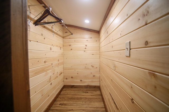 interior space with wood-type flooring and vaulted ceiling