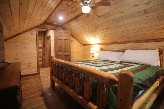 bedroom with ceiling fan, wood-type flooring, wooden walls, and wooden ceiling