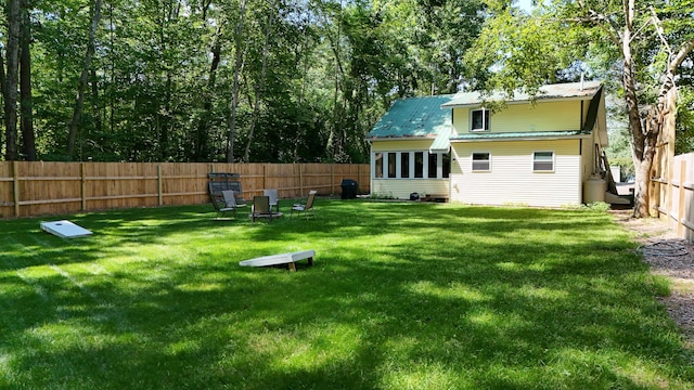 back of property featuring a lawn