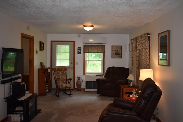 carpeted living room with a textured ceiling, heating unit, and an AC wall unit