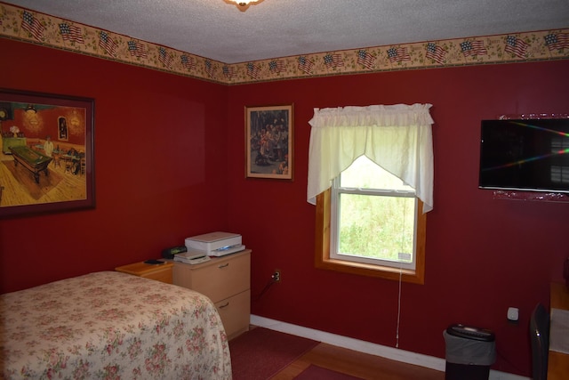 bedroom featuring a textured ceiling