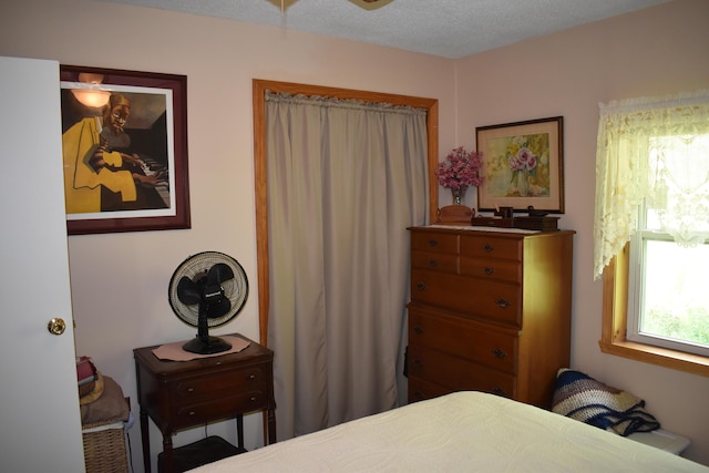 bedroom featuring a textured ceiling