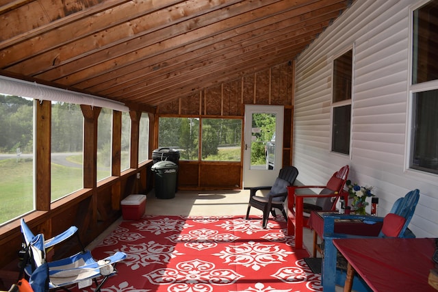 sunroom featuring vaulted ceiling