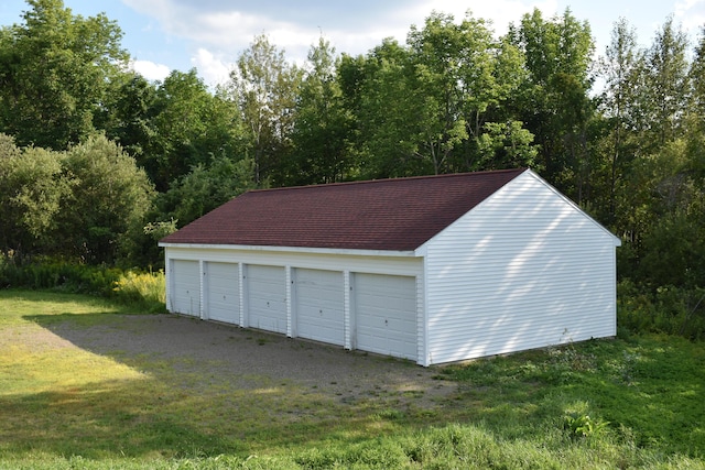 garage featuring a yard