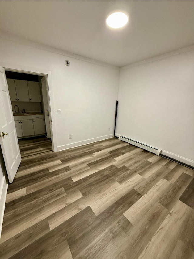 unfurnished room featuring hardwood / wood-style flooring