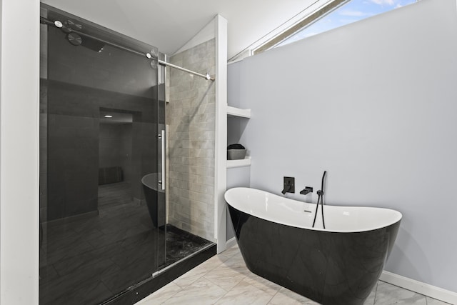 bathroom with shower with separate bathtub and vaulted ceiling