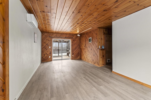 spare room featuring a wall mounted AC, wooden walls, wooden ceiling, and light wood-type flooring