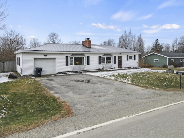 ranch-style home featuring a garage